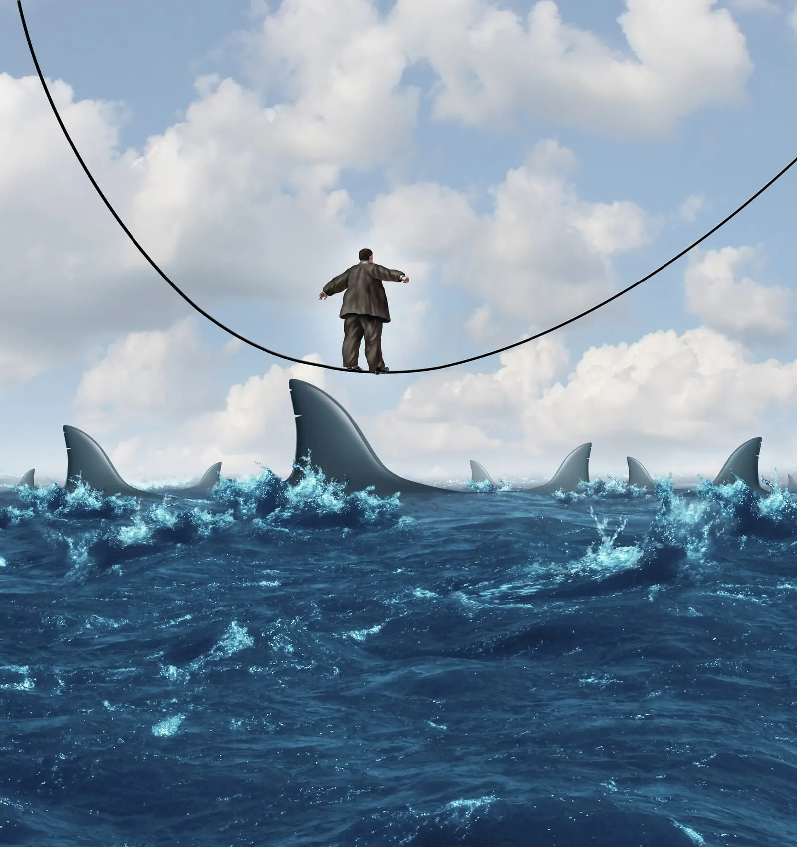 Man balancing on a tightrope above a rough sea, among shark fins
