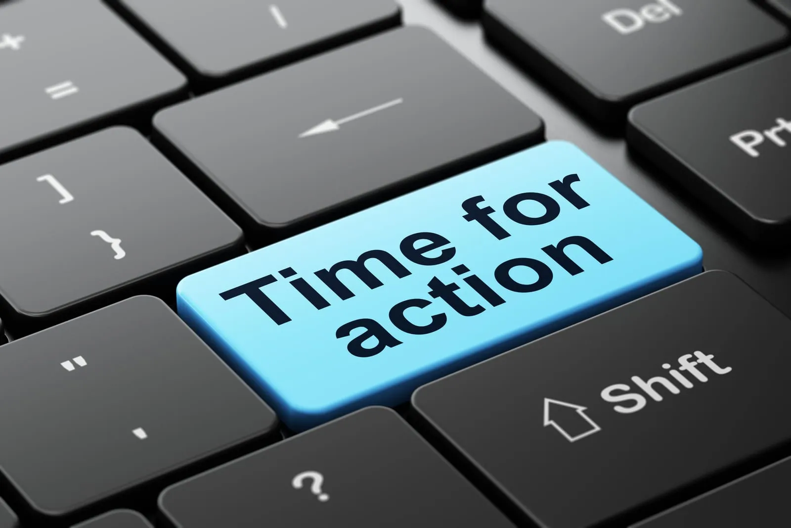 Computer keyboard with a blue key reading “Time for action”
