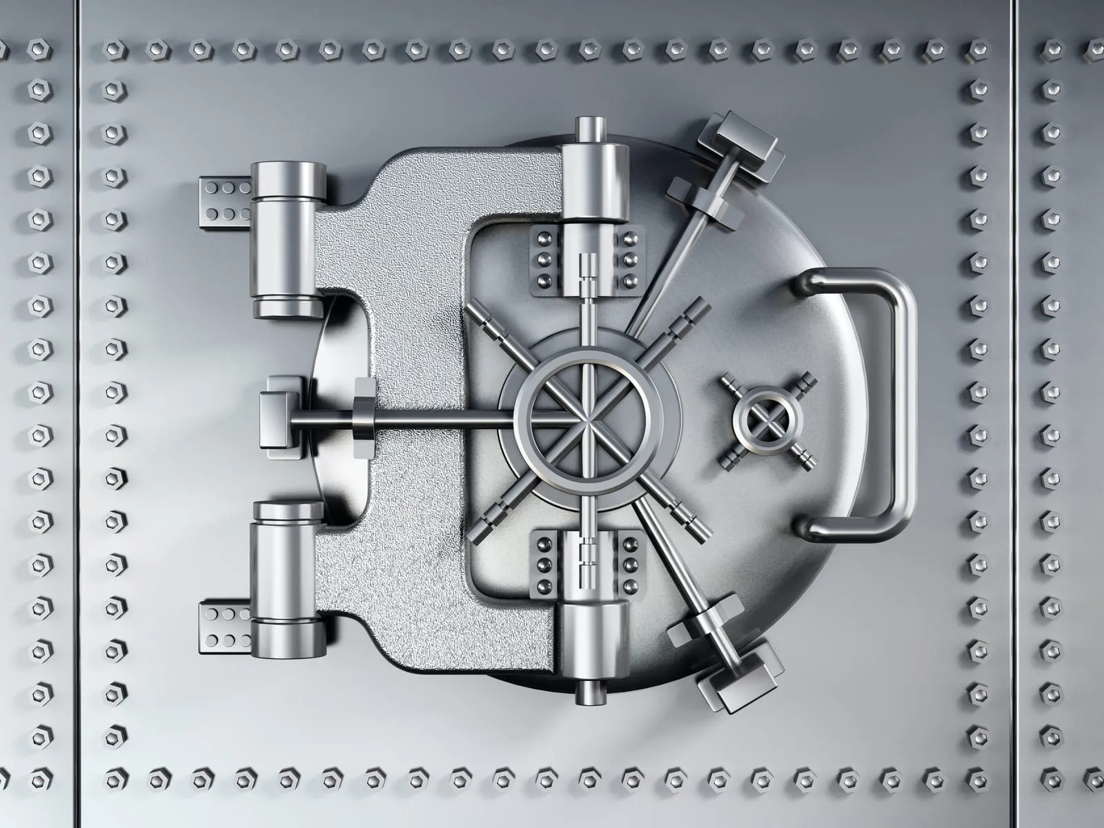 Closed circular steel vault door with the locking mechanism in the centre